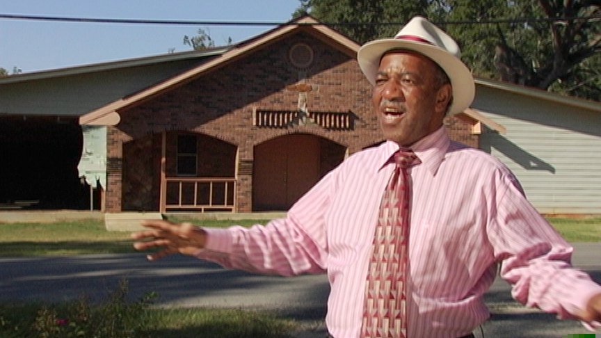 Minister with outstretched arms